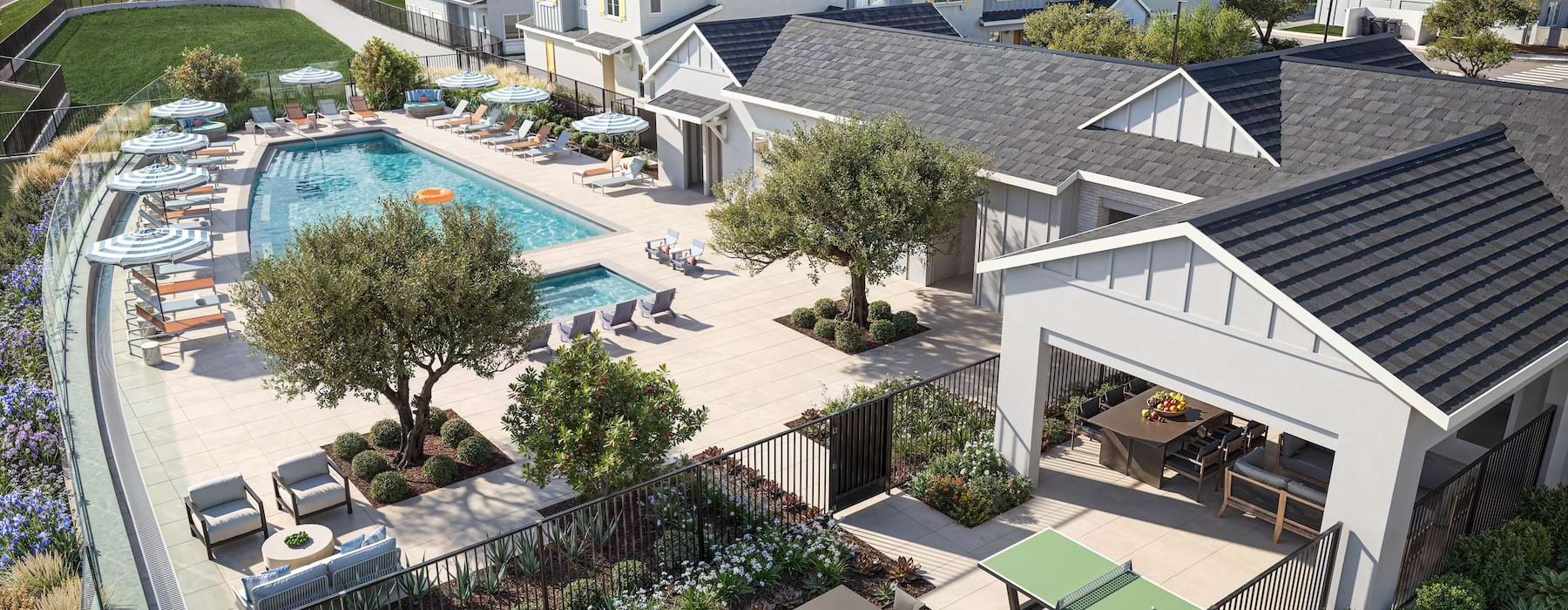 resort style pool with seating and a building behind