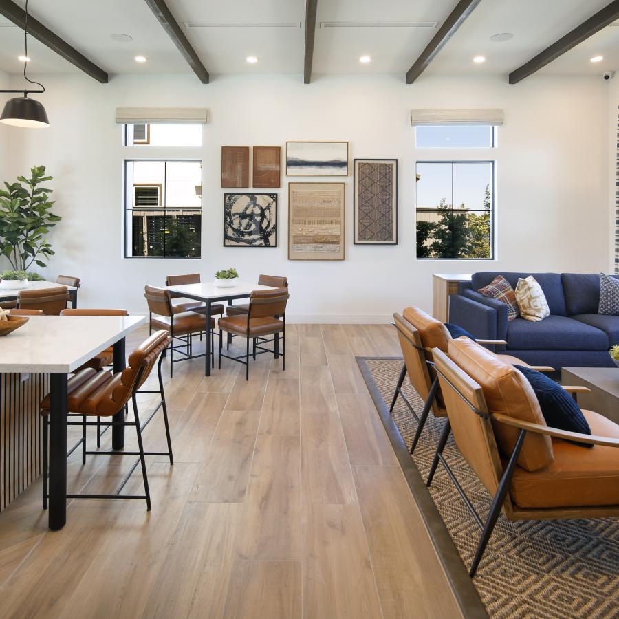 a room with a couch and chairs