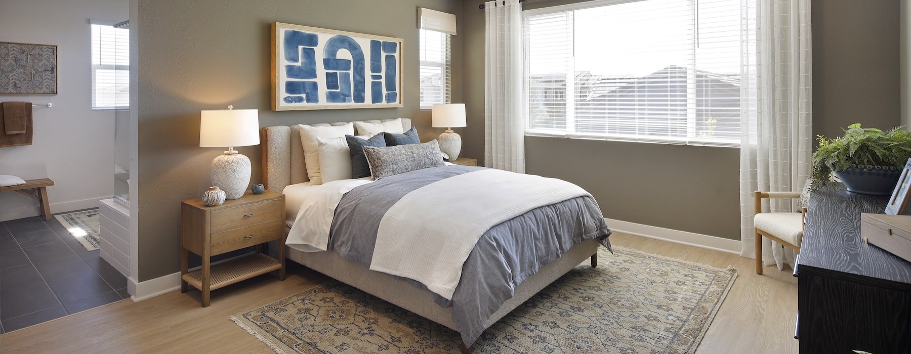 a bedroom with a bed and two nightstands