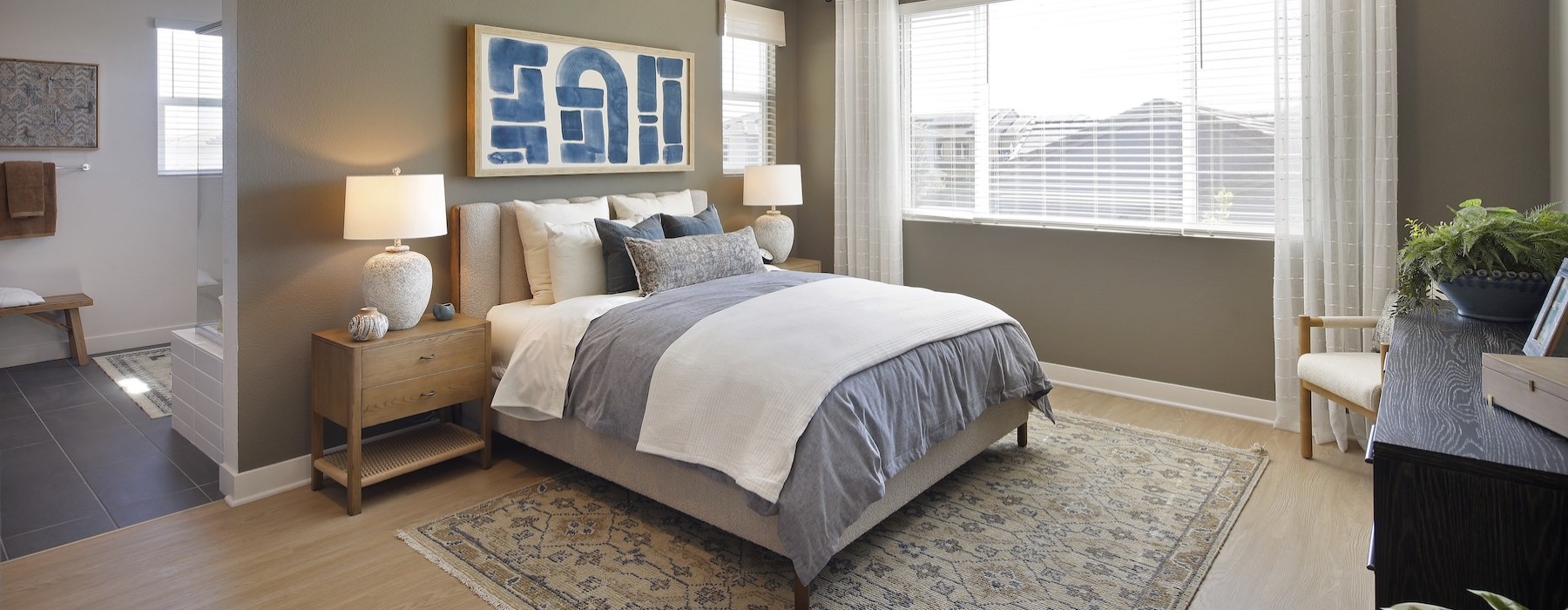 a bedroom with a bed and two nightstands